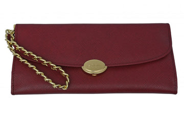 Maroon Textured leather wristlet with snap closure.